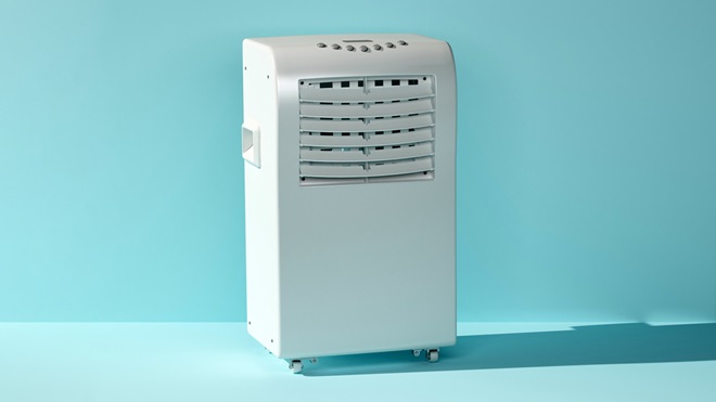 portable air conditioner on a light blue background